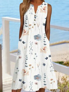 Sleeveless dress with a pointed neckline and floral print